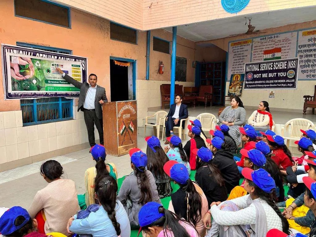 Students at a sustainability awareness session in a school hall